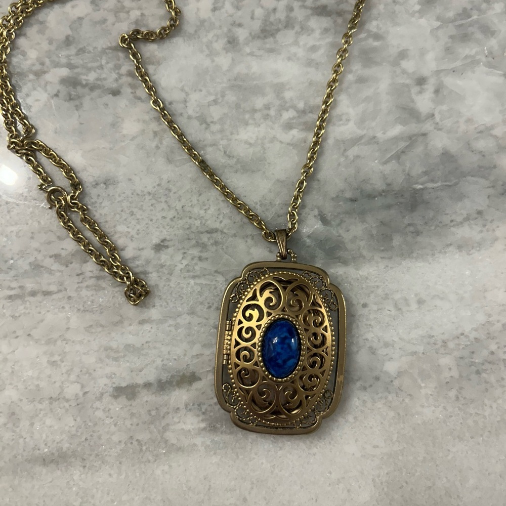 Elegant Gold Necklace with Blue Stone